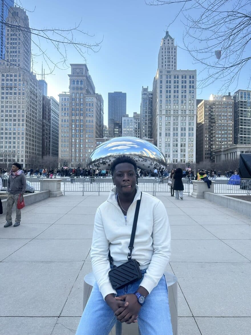 Edmond at the NSBE National Convention in Chicago, in front of Cloud Gate
